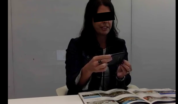 A research participant browsing a magazine during an augmented reality session